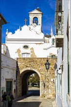 The most famous entrance to old town of Faro called Arco da vila