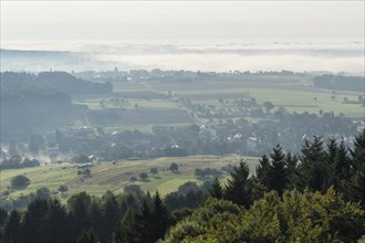 View from Katzenbuckel mountain with morning mist