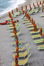 Sunbeds and umbrellas at the beach di Fegina in Monterosso al Mare
