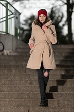 Smiling pretty young woman with long brunette hair