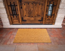 Blank doormat at the entrance of a house