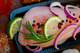 Fresh organic chicken breast with herbs and spices