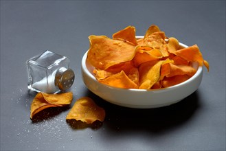 Sweet crisps in skin and salt container