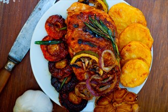 Roasted grilled BBQ chicken breast with herbs and spices rustic style