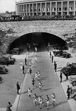 Participants in the marathon leave the Reichssportfeld through the tunnel after the lap in the stadium