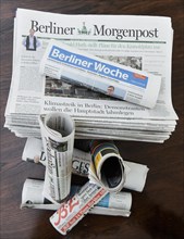 Stack of various daily newspapers