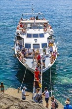 Tourists embark on the liner at Cinque Terre
