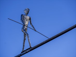 Stainless steel sculpture 'Walking Man' by the Frankfurt artist E. R. Nele above Friedberger Strasse