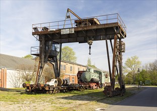 Lifting crane and rail vehicles