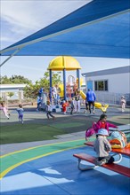 Children playing at a Preschool play yard in San Diego