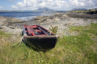 Boat tied up at the seaside at Renvyle along Wild Atlantic way. County Galway