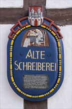 Sign Alte Schreiberei on a half-timbered house in the old town