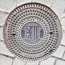 Manhole cover with coat of arms and inscription State capital Dresden