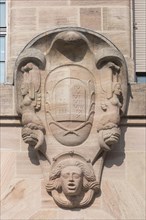 Coat of arms cartouche with Book of the Ten Commandments on the courthouse