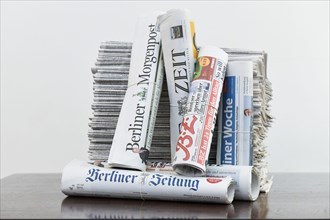 Stack of various daily newspapers
