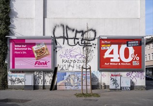 Large advertising posters for the delivery service Flink and Moebel Hoefner on a house wall
