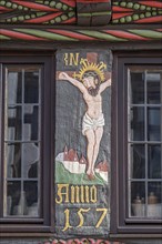 Depiction of the crucified Christ above the portal of the Adam- und Evahaus