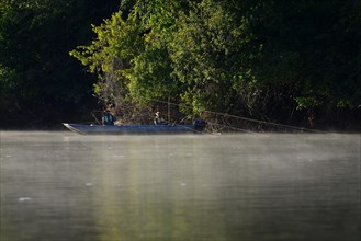 Two anglers in a boat on the Rio Sao Lourenco