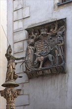 Coat of arms plaque of the Hungarian King Matthias Corvinius from 1488 and sculpture of Justitia on the stairs of the town hall 1537