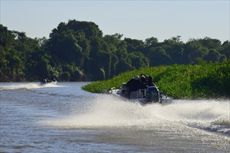 Motorboats with tourists on the Rio Sao Lourenco