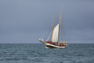 Sailing boat with tourists in summer