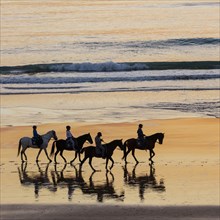 Riders on the beach