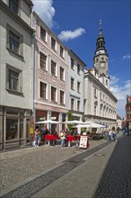 Pedestrian zone with cafes and town hall tower
