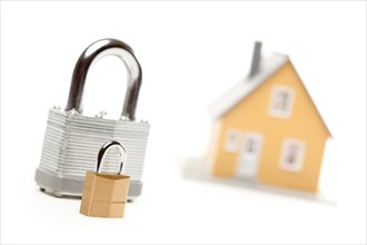 Big and small locks and house isolated on a white background