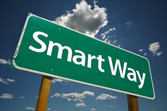 Smart way green road sign with dramatic clouds and sky