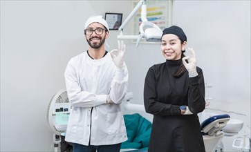 Portrait of dentist and her assistant in the office