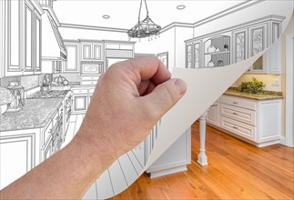 Male hand turning page of custom kitchen drawing to finished photograph underneath
