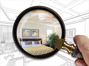 Hand holding magnifying glass revealing finished master bedroom over drawing
