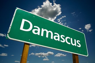 Damascus green road sign with dramatic clouds and sky