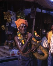 A devotee holding fire torch
