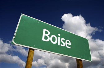 Boise road sign with dramatic blue sky and clouds
