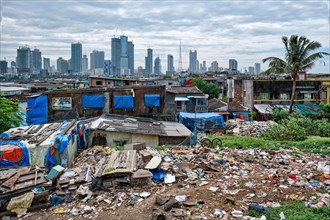 View of Mumbai skyline with skyscrapers over slums in Bandra suburb. Mumbai