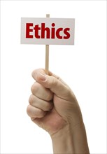 Ethics sign in male fist isolated on A white background