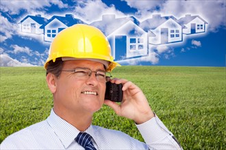 Contractor in hardhat on his cell phone over house icon