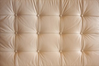 Comfortable buttoned leather pattern with dramatic lighting