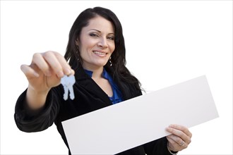 Smiling hispanic woman holding blank sign and keys isolated on white