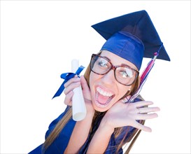 Goofy graduating young girl in cap and gown isolated on a white background