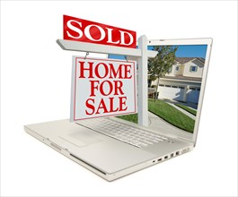 Sold home for sale sign & new home on laptop isolated on a white background