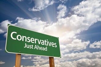 Conservatives green road sign with dramatic clouds
