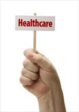 Healthcare sign in male fist isolated on A white background