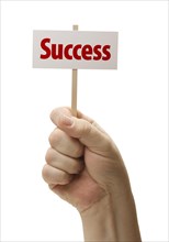 Success sign in male fist isolated on A white background