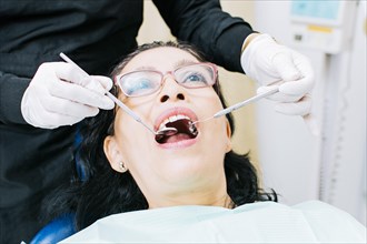 Female dentist checking a patient