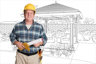 Male contractor with house plans wearing hard hat in front of custom pergola patio covering drawing
