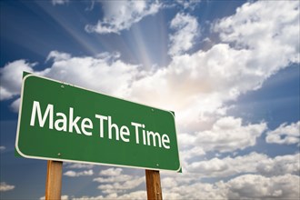 Make the time green road sign with dramatic clouds