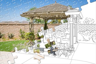 Puzzle pieces fitting together revealing finished pergola gazebo build over drawing