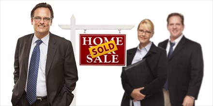 Businessmen and businesswoman with sold home for sale real estate sign isolated on a white background